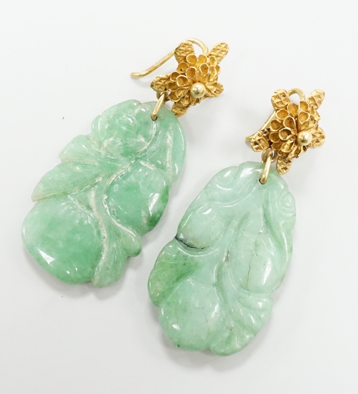 A pair of yellow metal and carved jade earrings, jade 30mm.